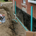 Why is there a need for waterproofing the foundations of a building?